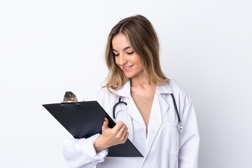 Young woman over isolated white background wearing a doctor gown and holding a folder