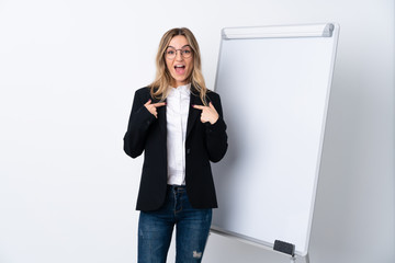 Young woman over isolated white background with surprise facial expression