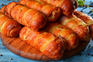 Delicious pastries on wooden background
