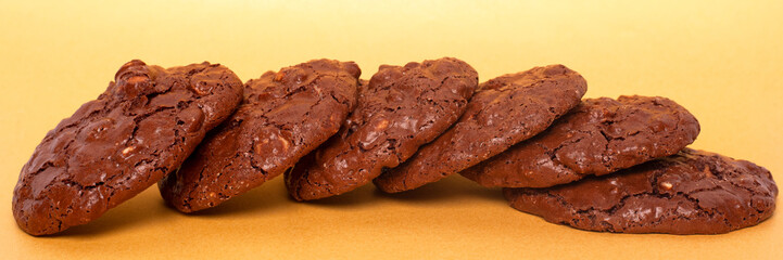 glazed oatmeal cookies closeup on a yellow background.