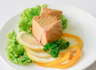 Tuna chunk on white plate.
