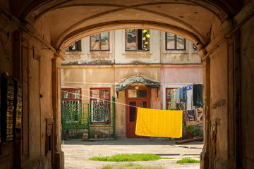 Fototapeta na wymiar Passage to the typical courtyard of the old historic building in Odessa city center, Ukraine