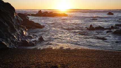 sunset in rocky beach