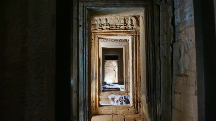 Fototapeta na wymiar Stone rock door interior decoration in Bayon Temple in Angkor wat complex, Siem Reap Cambodia