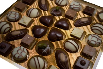 Variety of chocolate candies. Luxurious box of chocolates.Decorated chocolate candies, bitter and white chocolate candies filled with different types of creams. Perfect design and style of chocolates.