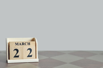 March 22, Empty Background with number cube on the table.	