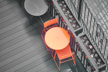 Black and red tables in a cafe. View from above.