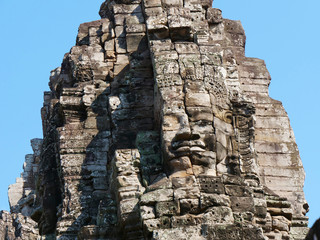 Face tower at the Bayon Temple in Angkor wat complex, Siem Reap Cambodia