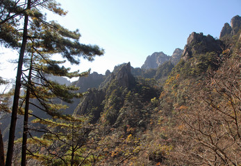 Huangshan Mountain in Anhui Province, China. View of peaks and trees as seen from the eastern steps. Huangshan (Yellow Mountain) is famous for its rugged cliffs, soaring peaks and forested slopes.