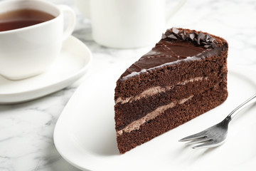 Piece of tasty chocolate cake served on plate