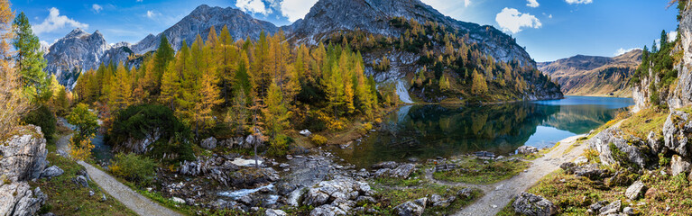 Fototapeta na wymiar Sunny autumn alpine Tappenkarsee lake and rocky mountains above, Kleinarl, Land Salzburg, Austria.