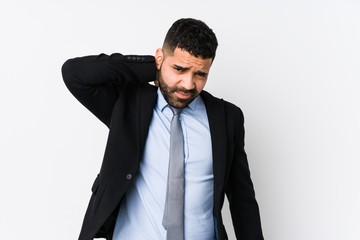 Young latin business woman against a white background isolated suffering neck pain due to sedentary lifestyle.