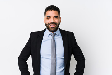 Young latin business woman against a white background isolated confident keeping hands on hips.