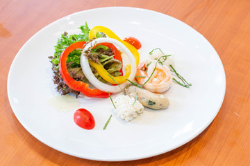  mixed seafood salad on white plate