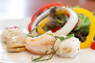  mixed seafood salad on white plate