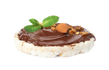 Puffed rice cake with chocolate spread, nuts and mint isolated on white