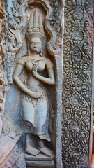 Stone rock carving art at Ta Prohm Temple in Angkor wat complex, Siem Reap Cambodia.