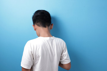 Rear view of sad boy, bullied concept with copy space
