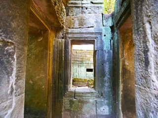 Stone rock ruin window at Ta Prohm Temple in Angkor wat complex, Siem Reap Cambodia.