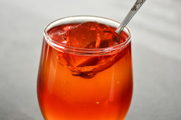 Glass cup with delicious fruit jelly.