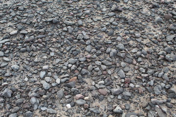 Small stones in concrete ground texture.