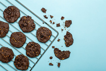 Homemade gluten-free chocolate chip cookies with cereals, nuts and organic cocoa. Cookies and pastries from rye flour on a colored background. Gluten free concept