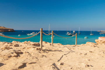 beach with umbrellas on the beach comta-ibiza