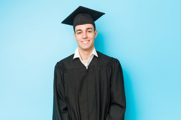 Young caucasian graduated man happy, smiling and cheerful.