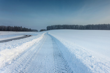 Fototapeta na wymiar winter landscape with the road in the snow