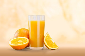 Orange juice and slices of orange fruit in glass