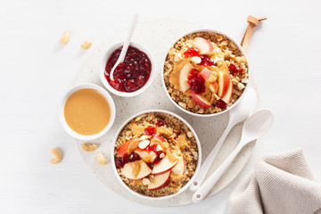 apple peanut butter quinoa bowl with jam and cashew for healthy breakfast