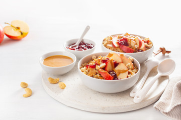 apple peanut butter quinoa bowl with jam and cashew for healthy breakfast