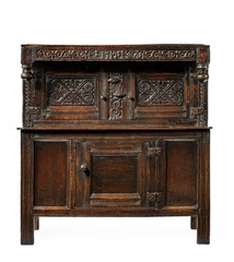 A fine 17th Century oak livery court cupboard large with fine carving isolated on white
