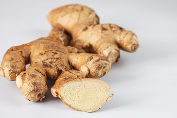 Fresh ginger root on a white background