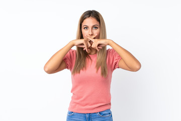 Young blonde woman over isolated white background showing a sign of silence gesture