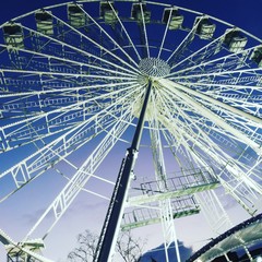 ferris wheel on background of blue sky