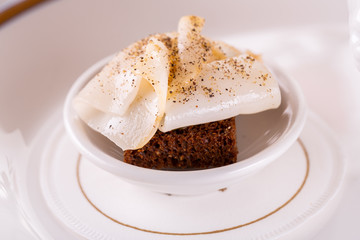 Black beard bread with pieces of lard sprinkled with pepper