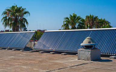 Vacuum solar cells for water heating system on the pool roof