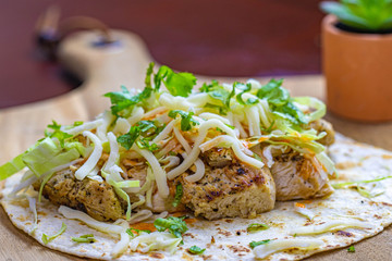 chicken wrap sandwich on tortilla bread  