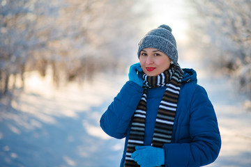 portrait of a young happy girl woman in winter clothes