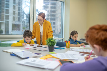 Teacher checking the work of her pupils