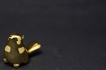 golden bird on black background