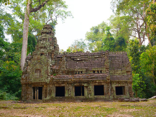 Abandoned stone rock architecture at Preah Khan temple Angkor Wat complex, Siem Reap Cambodia. A popular tourist attraction nestled among rainforest.
