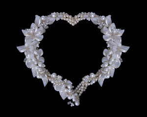 Frame of pearls and flowers on black