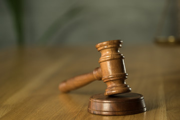 Symbol of law and justice on wooden table in lawyer office