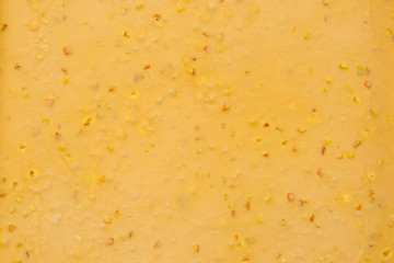 Cream honey or confiture with fruits. Background, texture, close up, top view