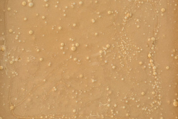 Frozen cream or nut butter background, texture, close up
