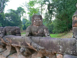 Fototapeta na wymiar Stone rock sculpture at Preah Khan temple Angkor Wat complex, Siem Reap Cambodia. A popular tourist attraction nestled among rainforest.