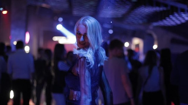 Attractive Dancing Blonde In The Club, Neon Light, Motion Effects.