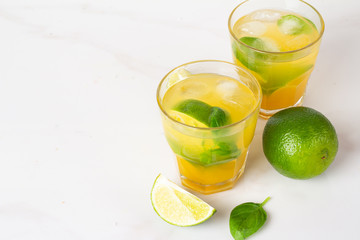 refreshing lemonade with ice mint and lime on a white background